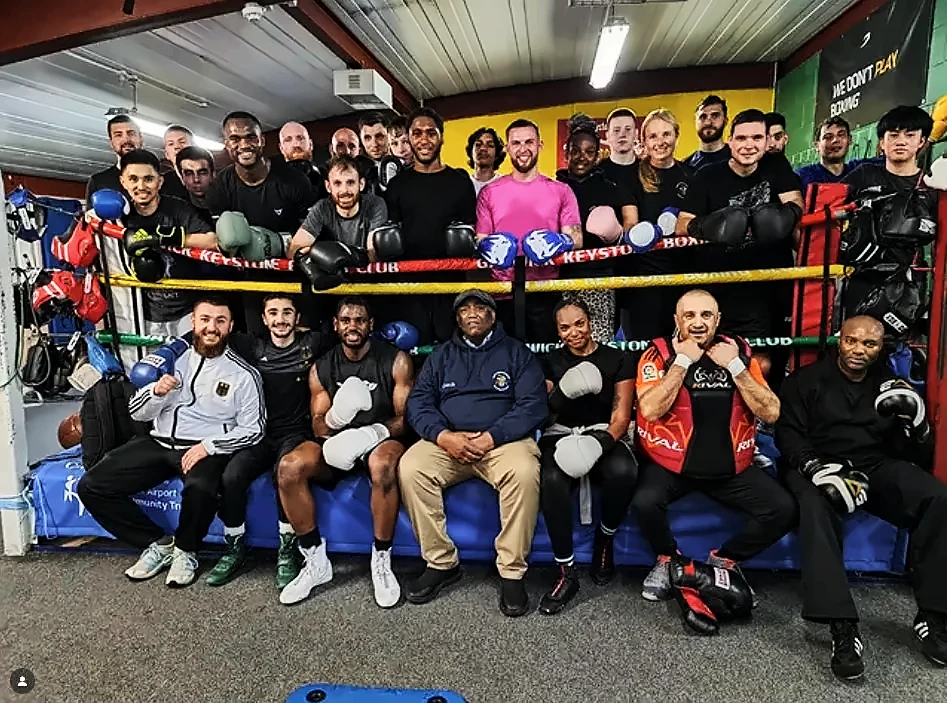 Keystone boxers and coaches together around the ring